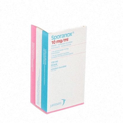 Boîte de Sporanox et ordinateur avec site de pharmacie en ligne